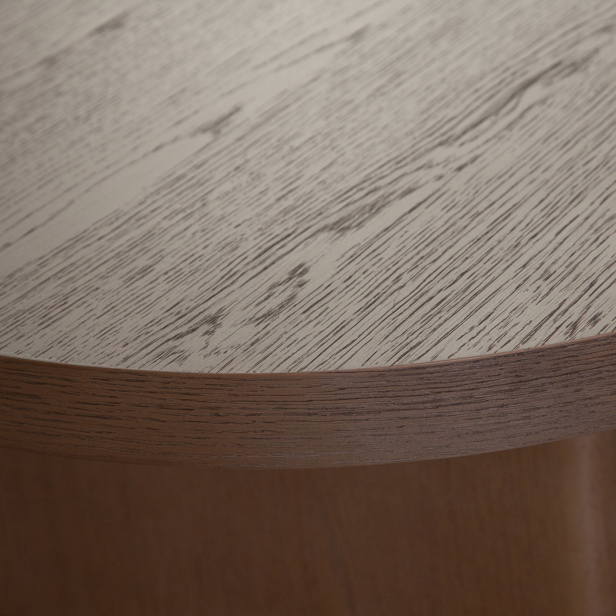 Aspen Oval Cocktail Table in Dark Oak finish by Diamond Sofa - styled in a staged room by Center Stage Home Design