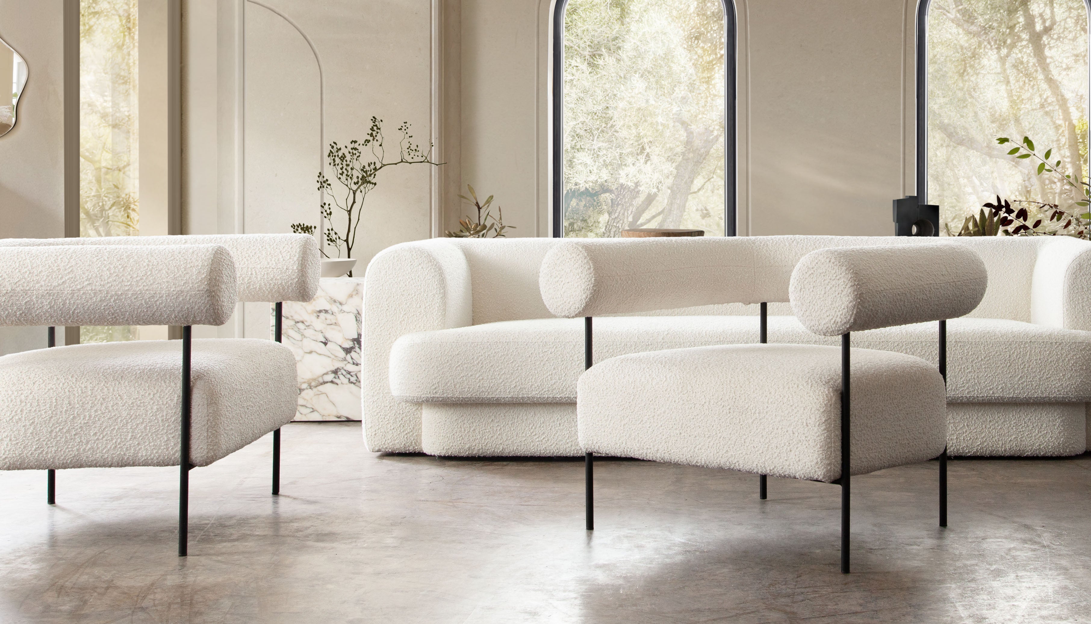 District Accent Chair in Ivory Boucle Fabric w/ Black Metal Frame by Diamond Sofa - styled in a staged room by Center Stage Home Design