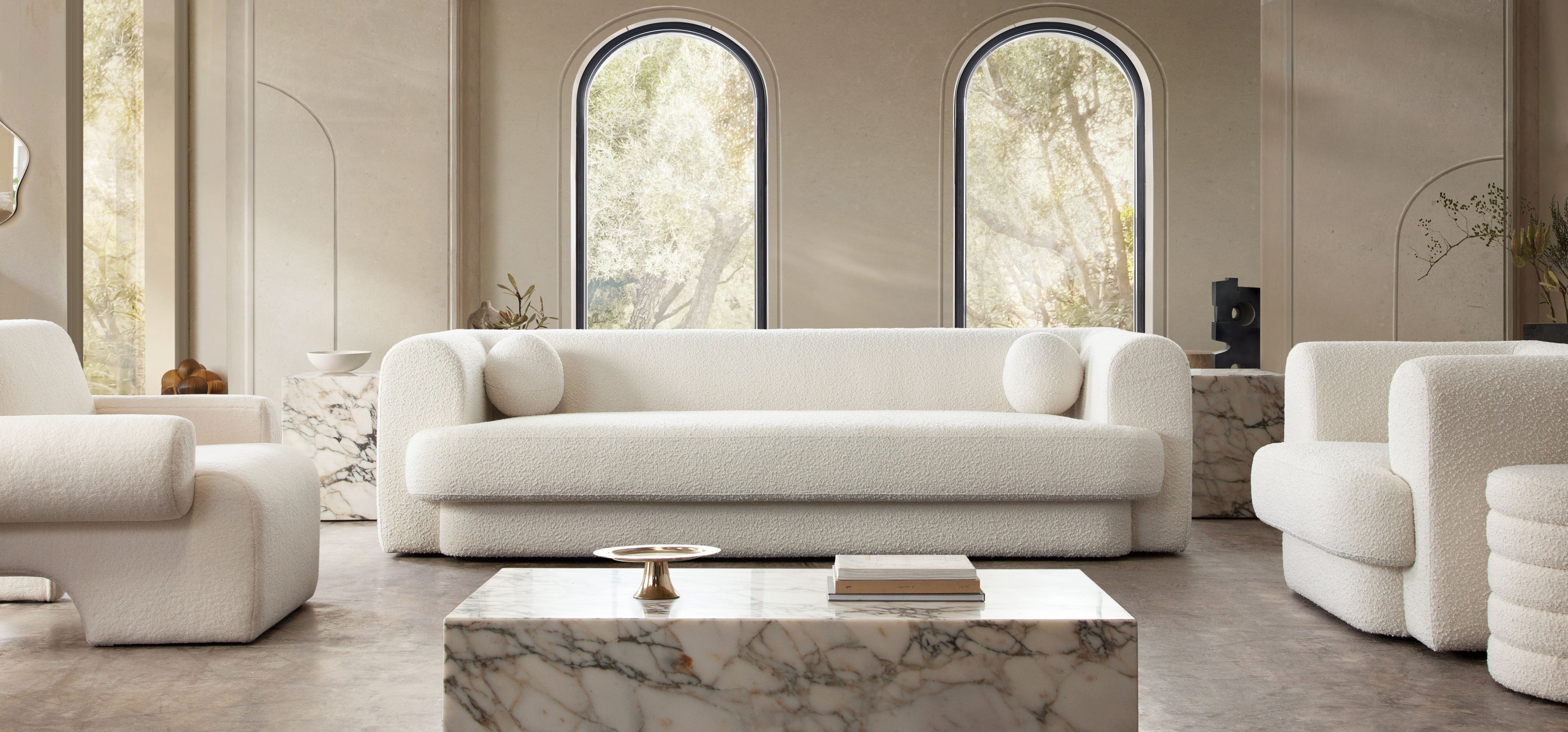 Form Sofa in Ivory Boucle Fabric w/ (2) Accent Pillow Balls by Diamond Sofa - styled in a staged room by Center Stage Home Design