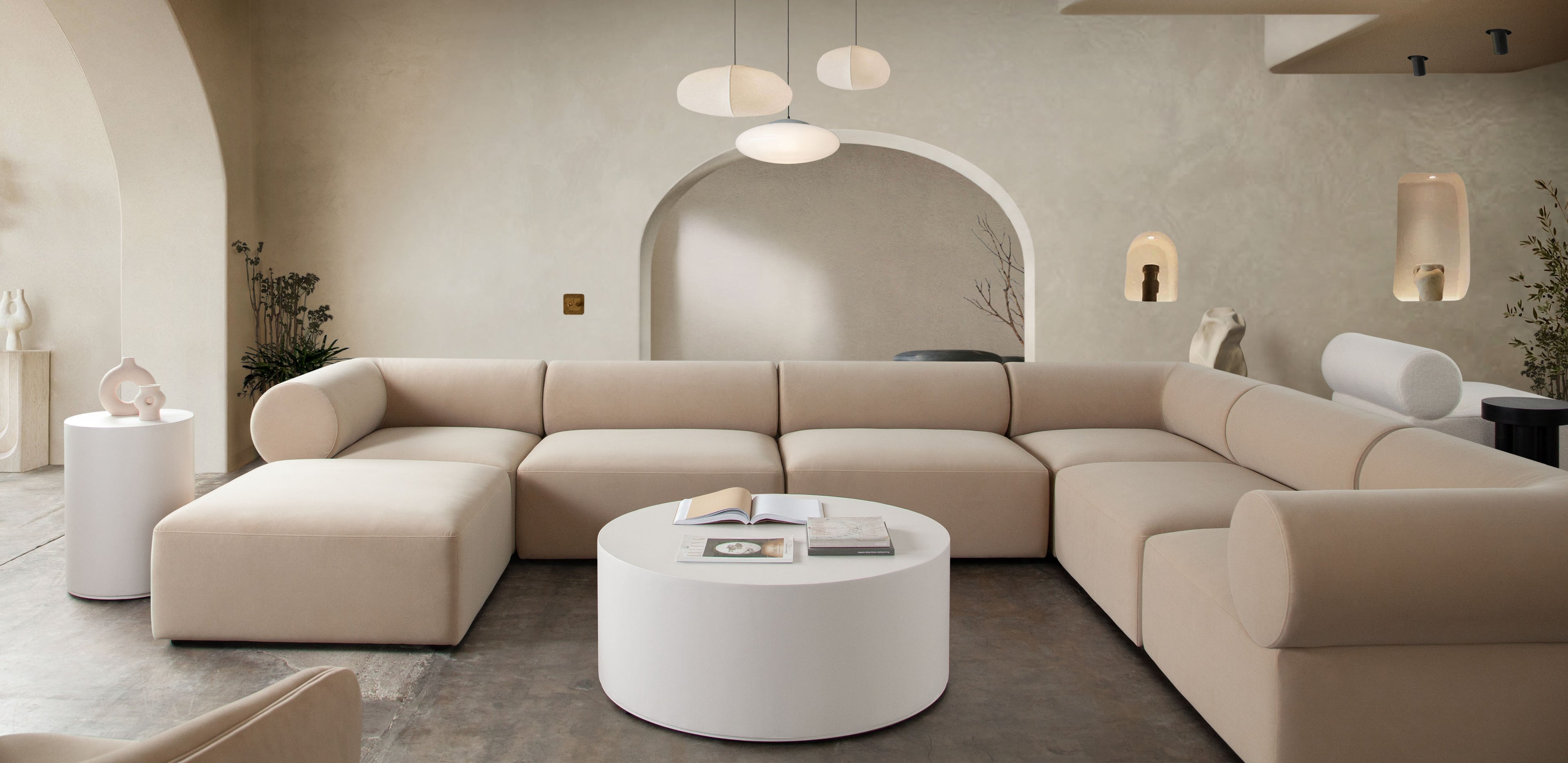 Montage Round Cocktail Table in Ivory Faux Cement Finish by Diamond Sofa - styled in a staged room by Center Stage Home Design