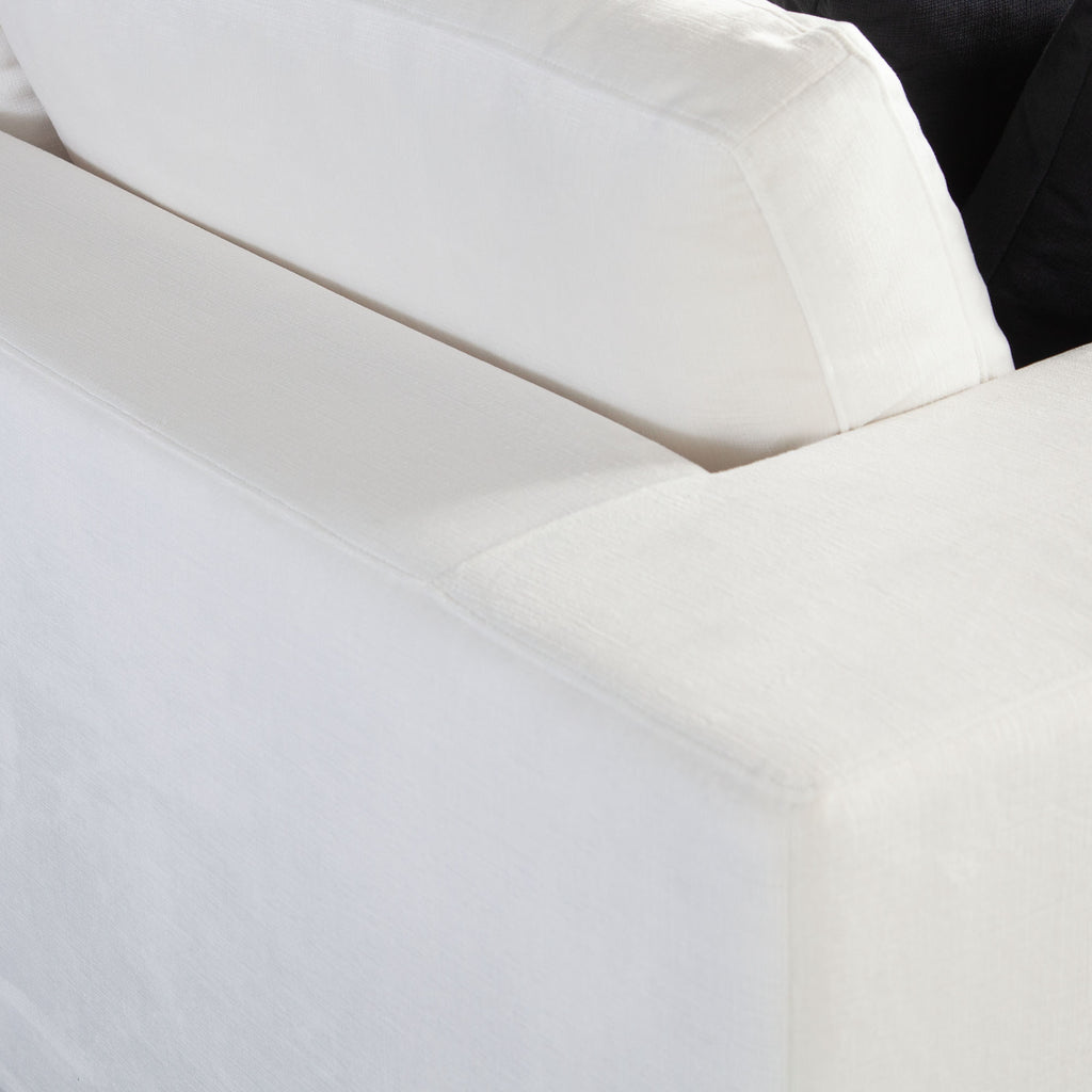 Muse Sofa in Mist White Performance Fabric w/ (4) Black Accent Pillows by Diamond Sofa - styled in a staged room by Center Stage Home Design