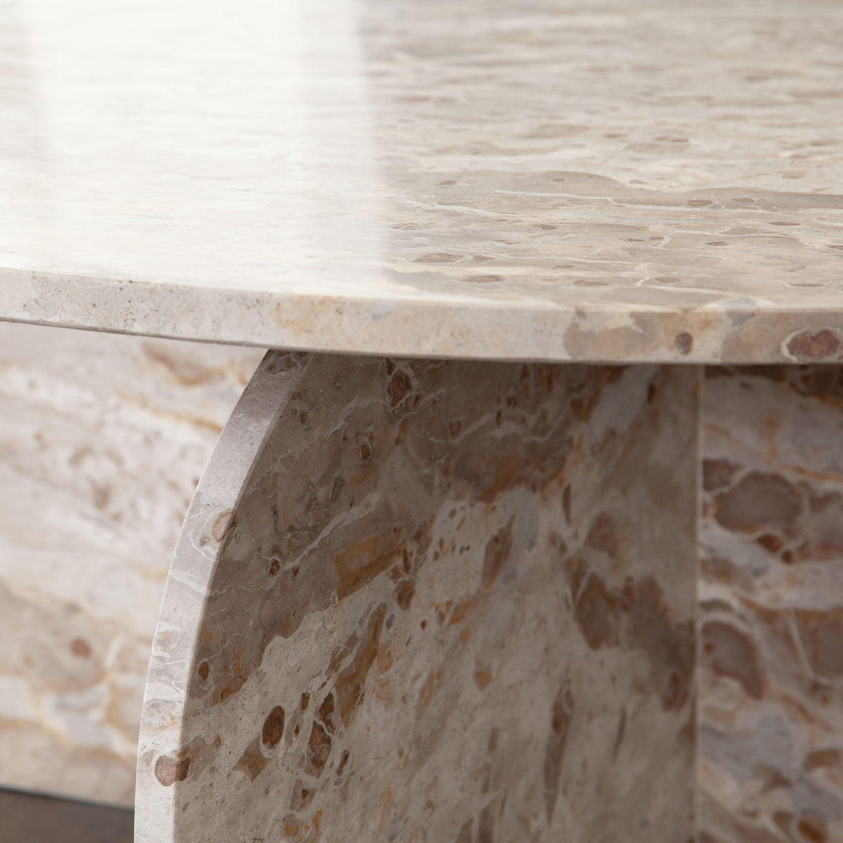 Nebula Round Cocktail Table in Genuine Marble Panther Beige finish by Diamond Sofa - styled in a staged room by Center Stage Home Design