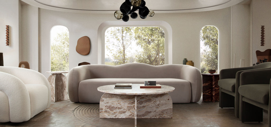 Nebula Round Cocktail Table in Genuine Marble Panther Beige finish by Diamond Sofa - styled in a staged room by Center Stage Home Design