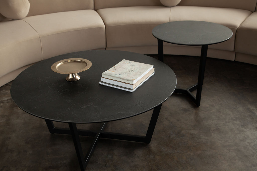 Onyx Round Cocktail Table w/ Black Ceramic Glass Top & Black Metal Leg by Diamond Sofa - styled in a staged room by Center Stage Home Design
