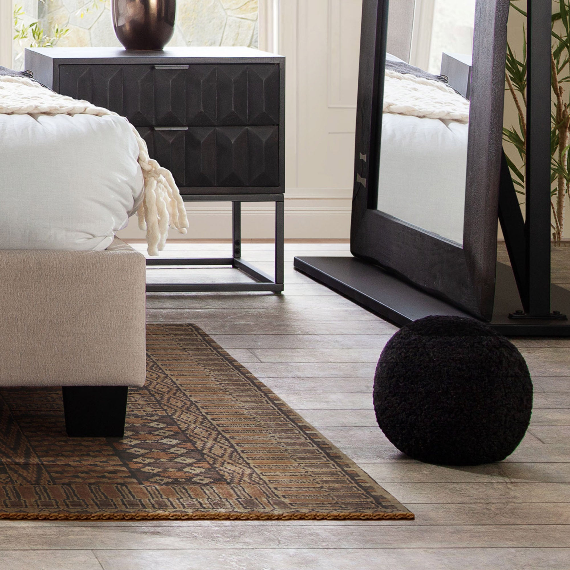 Set of (2) 10" Round Accent Pillows in Black Faux Sheepskin by Diamond Sofa - styled in a staged room by Center Stage Home Design