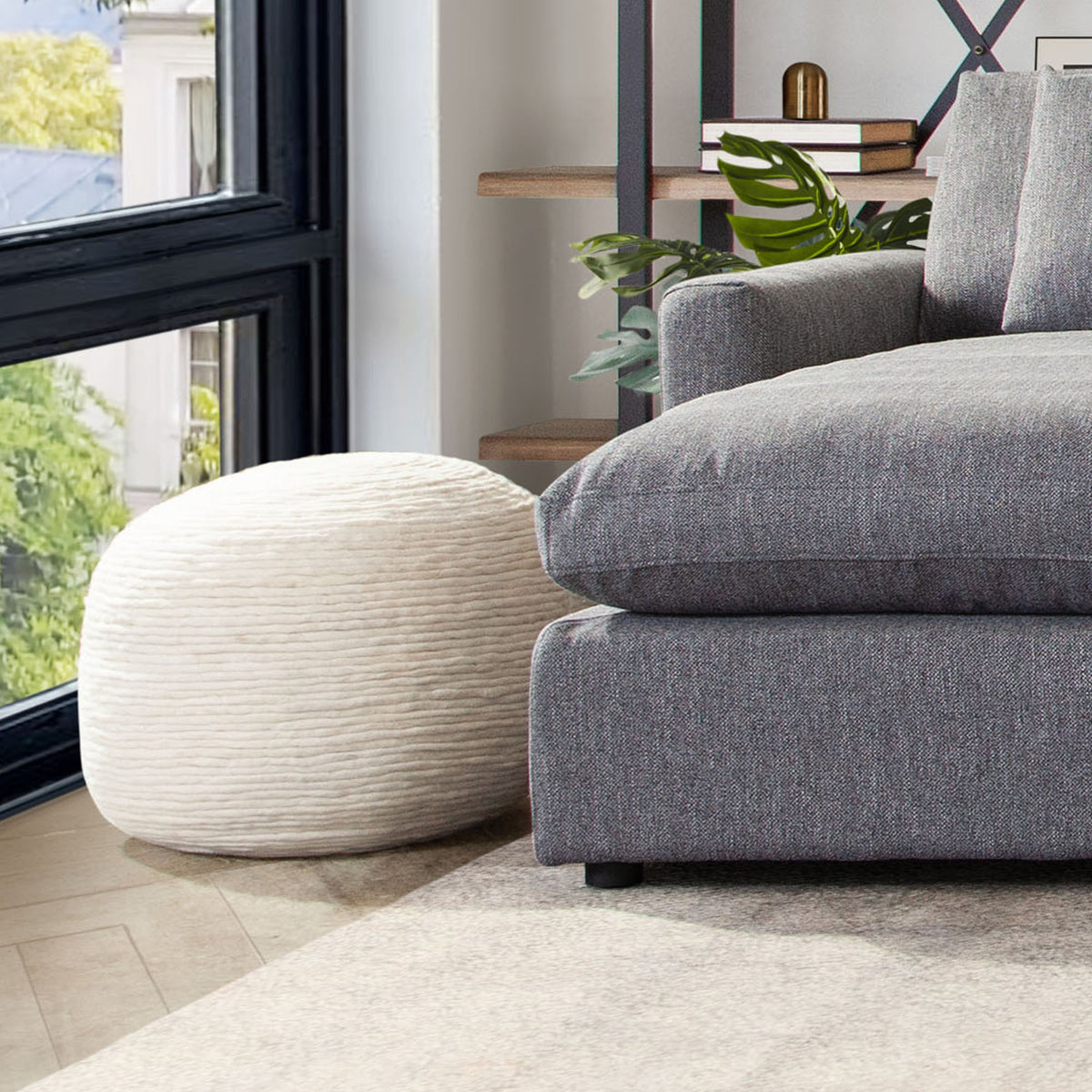 Round Pouf in White Dyed Natural Wool by Diamond Sofa - styled in a staged room by Center Stage Home Design