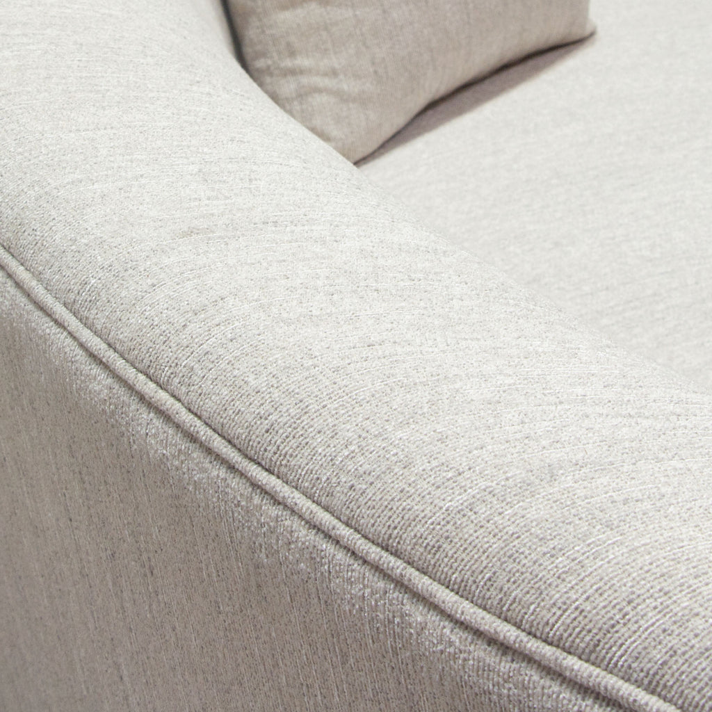 Raven Sofa in Light Cream Fabric w/ Brushed Silver Accent Trim by Diamond Sofa - styled in a staged room by Center Stage Home Design