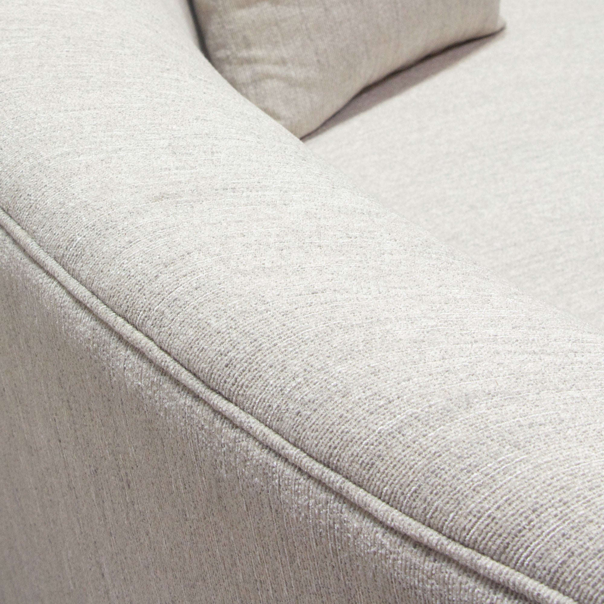 Raven Sofa in Light Cream Fabric w/ Brushed Silver Accent Trim by Diamond Sofa - styled in a staged room by Center Stage Home Design