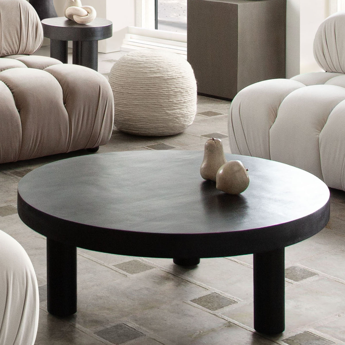 Rune 42" Round Cocktail Table w/ Solid Acacia Wood Top & Iron Leg Base in Black Finish by Diamond Sofa - styled in a staged room by Center Stage Home Design