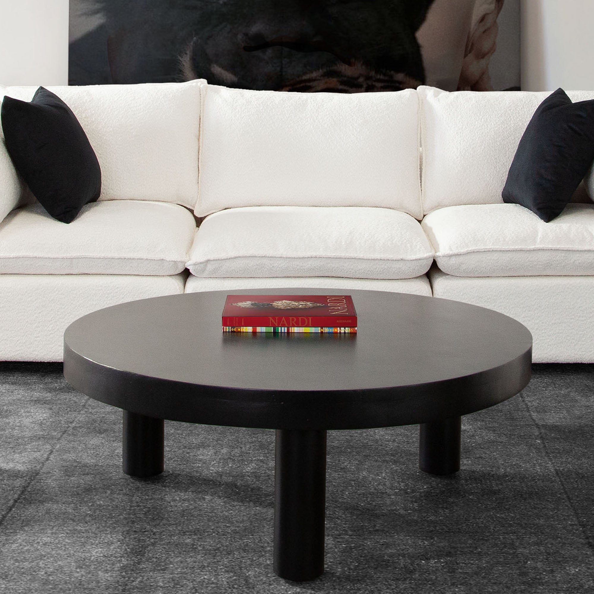 Rune 42" Round Cocktail Table w/ Solid Acacia Wood Top & Iron Leg Base in Black Finish by Diamond Sofa - styled in a staged room by Center Stage Home Design