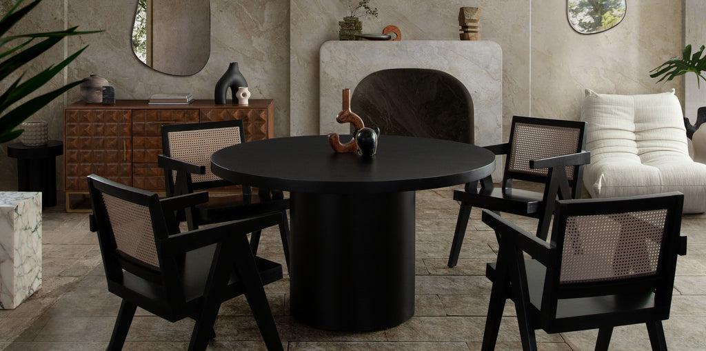 Rune 54" Round Dining Table w/ Solid Acacia Wood Top & Iron Pedestal Base in Black Finish by Diamond Sofa - styled in a staged room by Center Stage Home Design