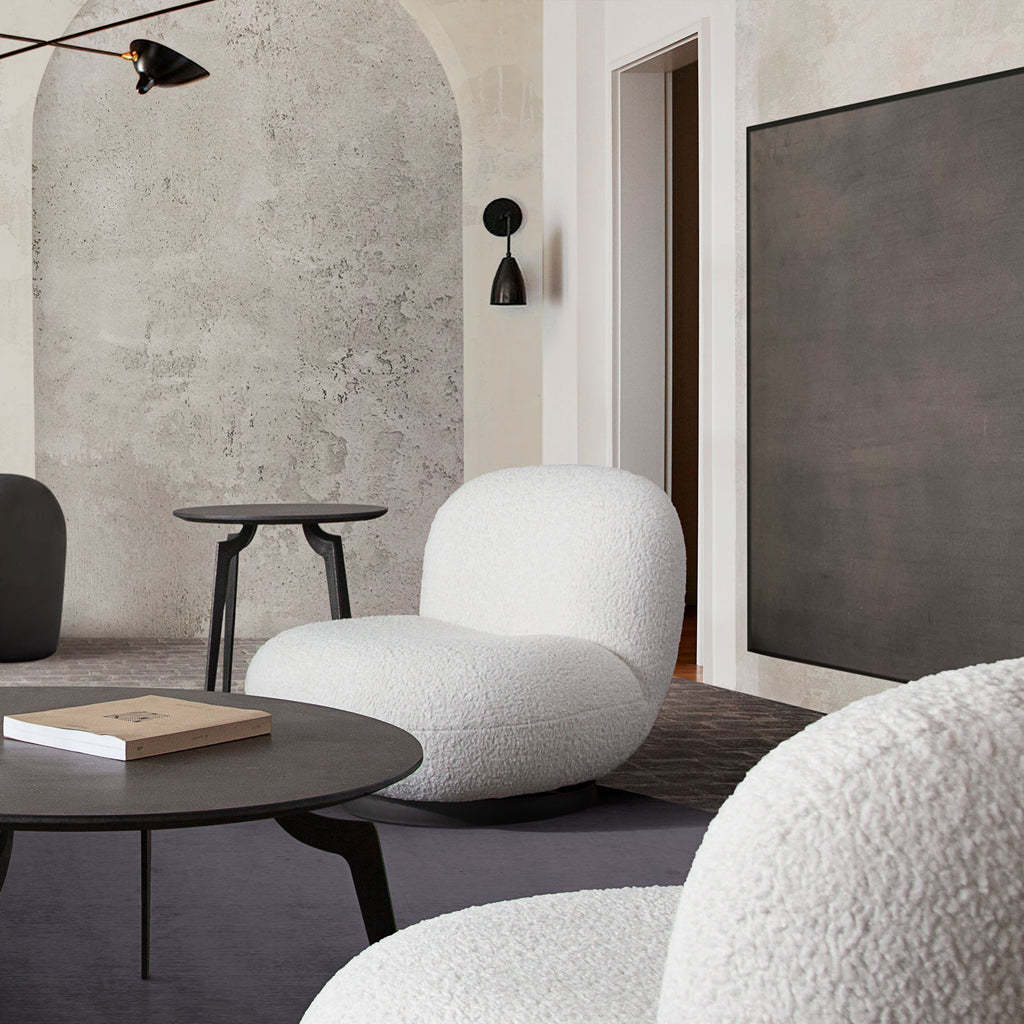 Simone Swivel Accent Chair in White Faux Sheepskin Fabric by Diamond Sofa - styled in a staged room by Center Stage Home Design