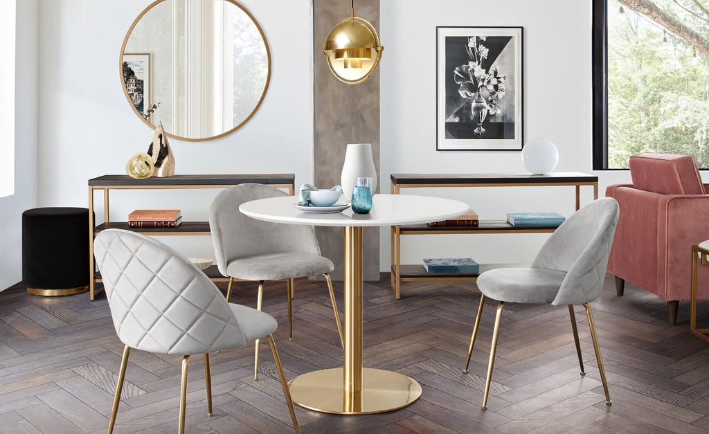 Stella 36" Round Dining Table w/ White Lacquer Top and Brushed Gold Metal Base by Diamond Sofa - styled in a staged room by Center Stage Home Design