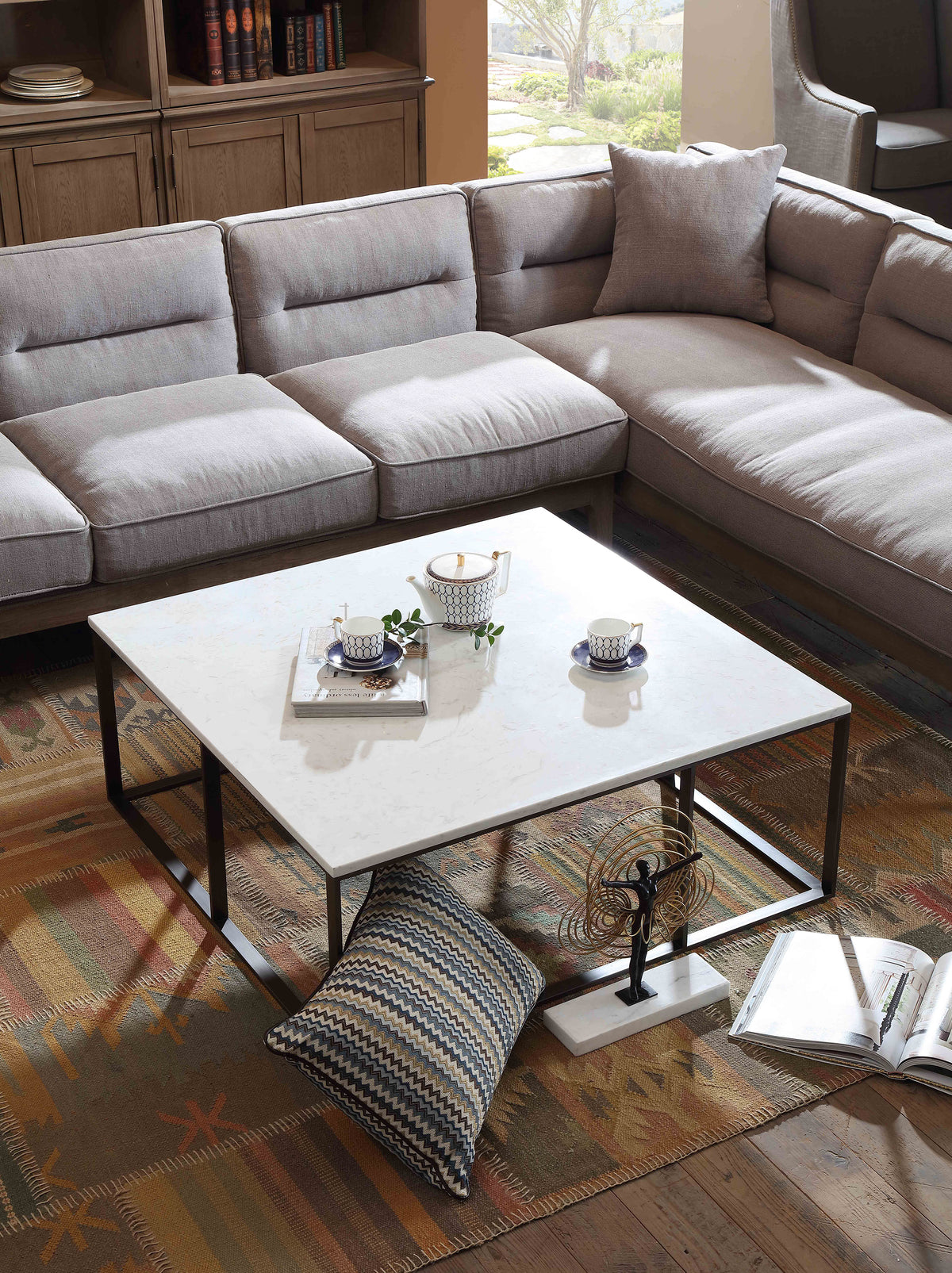 Surface Square Cocktail Table w/ Engineered Marble Top & Black Powder Coated Metal Base by Diamond Sofa - styled in a staged room by Center Stage Home Design