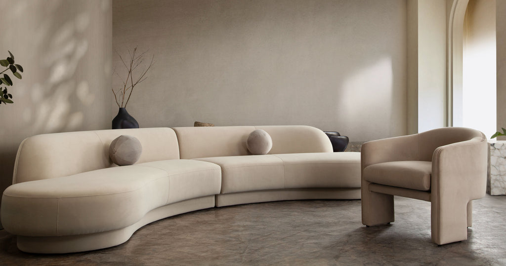 Zelda 2PC Modular Curved Armless Chaise in Light Camel Performance Velvet w/ (2) Accent Pillow Balls by Diamond Sofa - styled in a staged room by Center Stage Home Design
